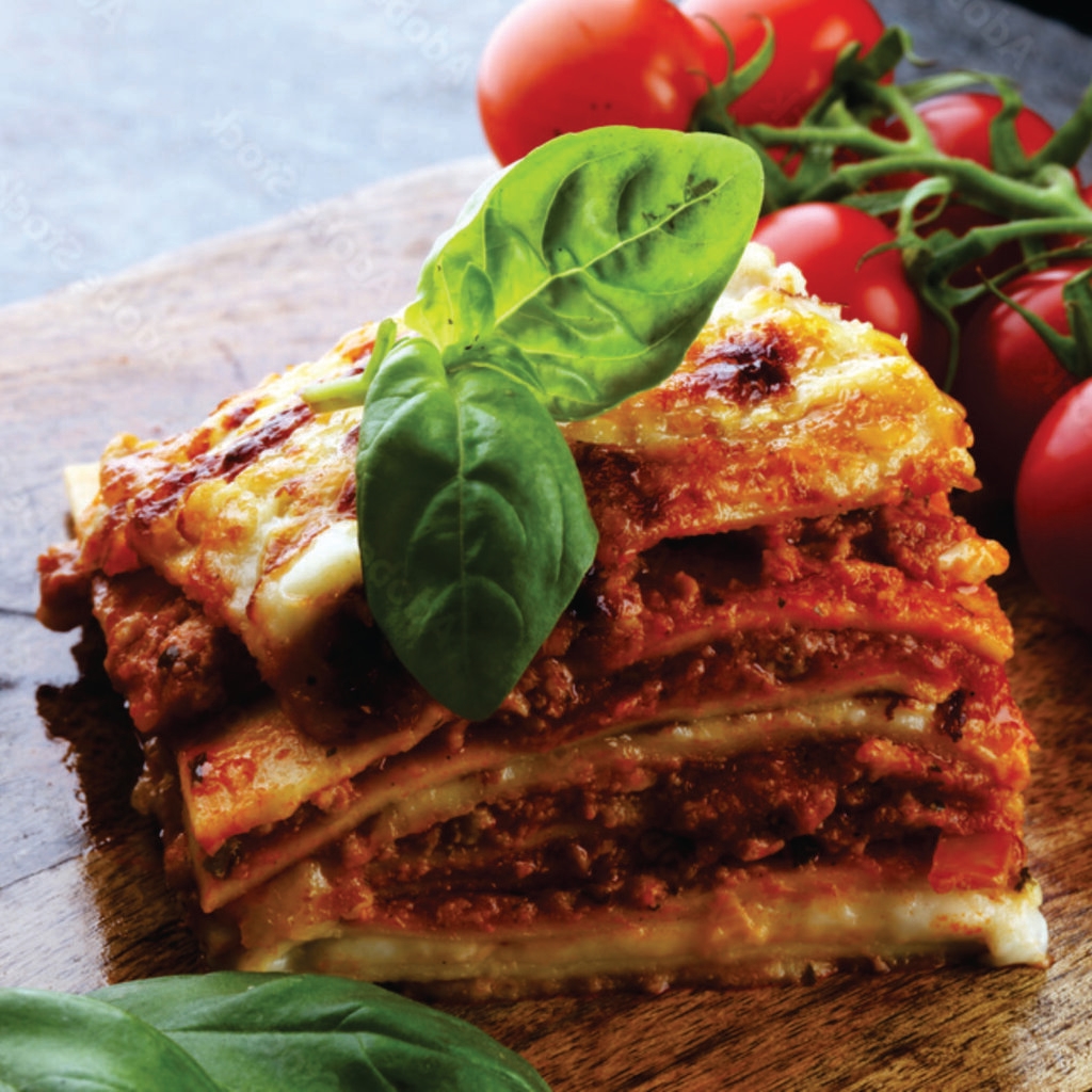 prepared frozen spicy beef lasagne, heat-n-eat ready meal that can be prepared in the microwave, airfryer or oven. Layers of tender pasta, seasoned ground beef, bechamel sauce, and a lightly spiced tomato sauce, all blanketed in creamy melted cheese.