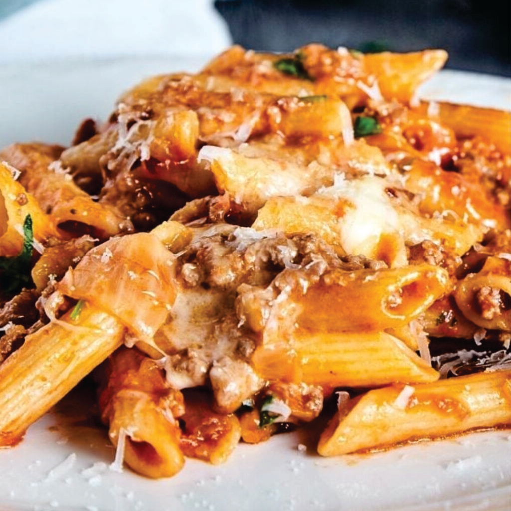 prepared frozen beef bolognese macaroni, heat-n-eat ready meal that can be prepared in the microwave, airfryer or oven. Each serving features perfectly cooked macaroni and premium chicken breast, enveloped in a smooth, creamy sauce that strikes an ideal balance between richness and subtlety. The crowning glory is a blanket of melted cheese that adds a delightful gooey texture and an extra depth of flavor to every forkful.