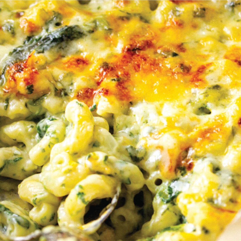 prepared frozen vegetarian spinach and feta macaroni, heat-n-eat ready meal that can be prepared in the microwave, airfryer or oven. Tender macaroni, folded together with wilted spinach and creamy feta in a luscious sauce that perfectly balances earthy and salty flavors.